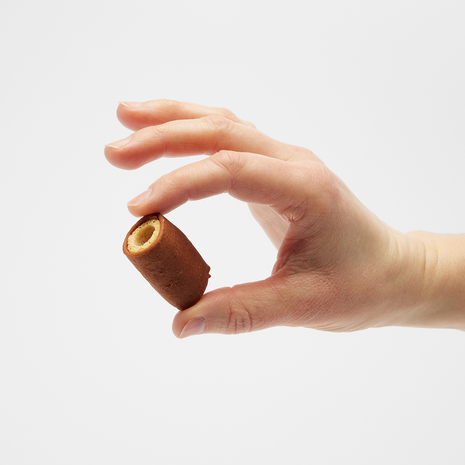 Caucasian woman holding a Good'n'Tasty Soft and Crunchy treat