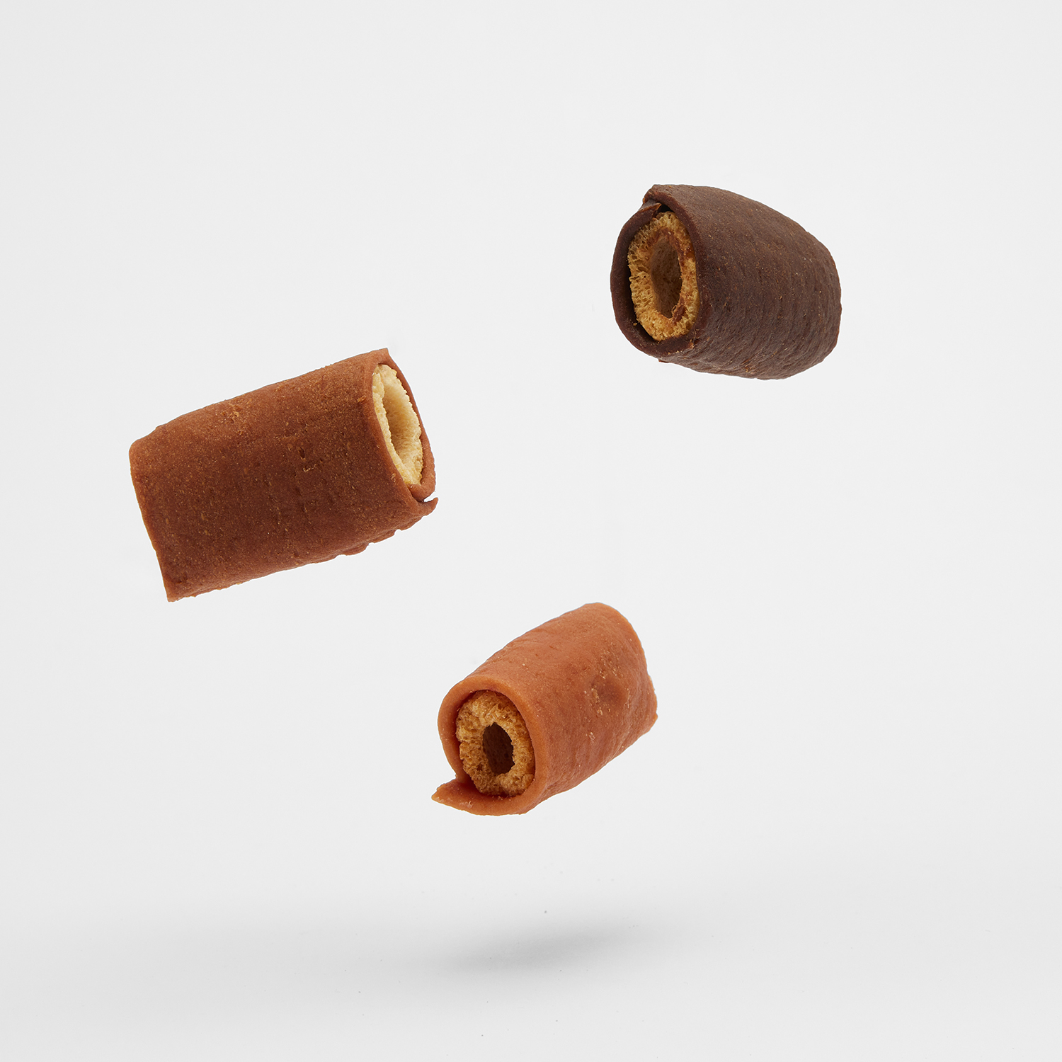 Good'n'Tasty Soft and Crunchy treats floating on a grey background